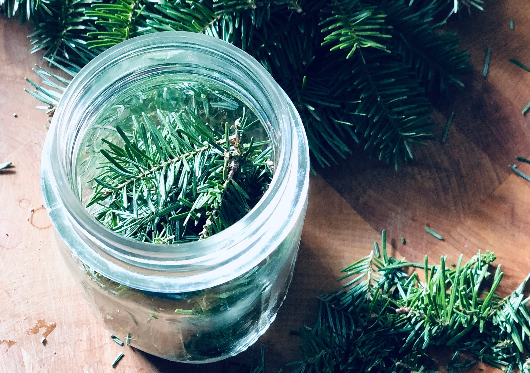 Evergreen needles in a mason jar